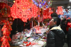 kid looking at new year decorations